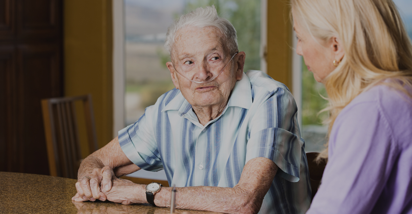 Senior Man on oxygen asking questions